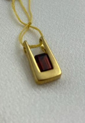 Garnett pendant set on 14 KT Yellow Gold